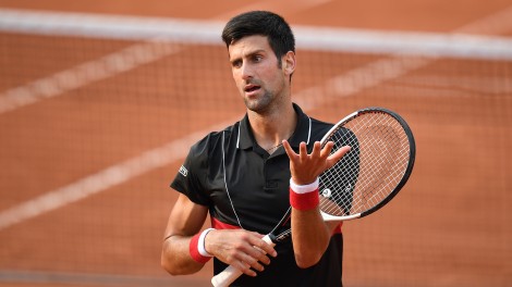 TOPSHOT - Serbia's Novak Djokovic reacts after a point in the fourth set against Italy's Marco Cecchinato during their men's singles quarter-final match on day ten of The Roland Garros 2018 French Open tennis tournament in Paris on June 5, 2018. (Photo by Christophe ARCHAMBAULT / AFP)        (Photo credit should read CHRISTOPHE ARCHAMBAULT/AFP/Getty Images)