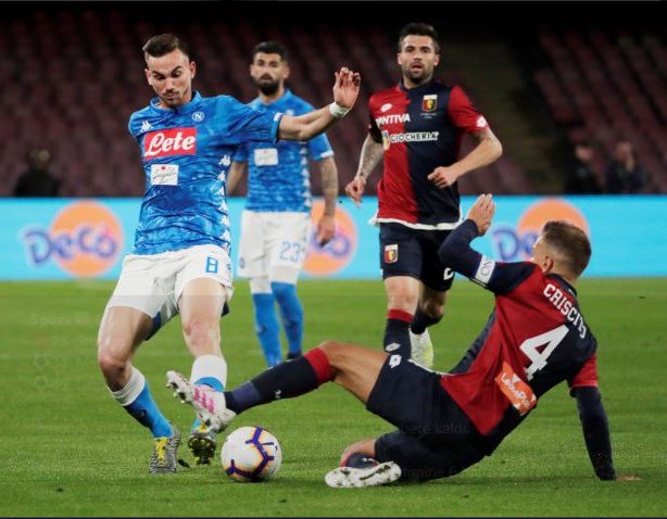 Jens-Lys Cajuste of SSC Napoli competes for the ball with Milan
