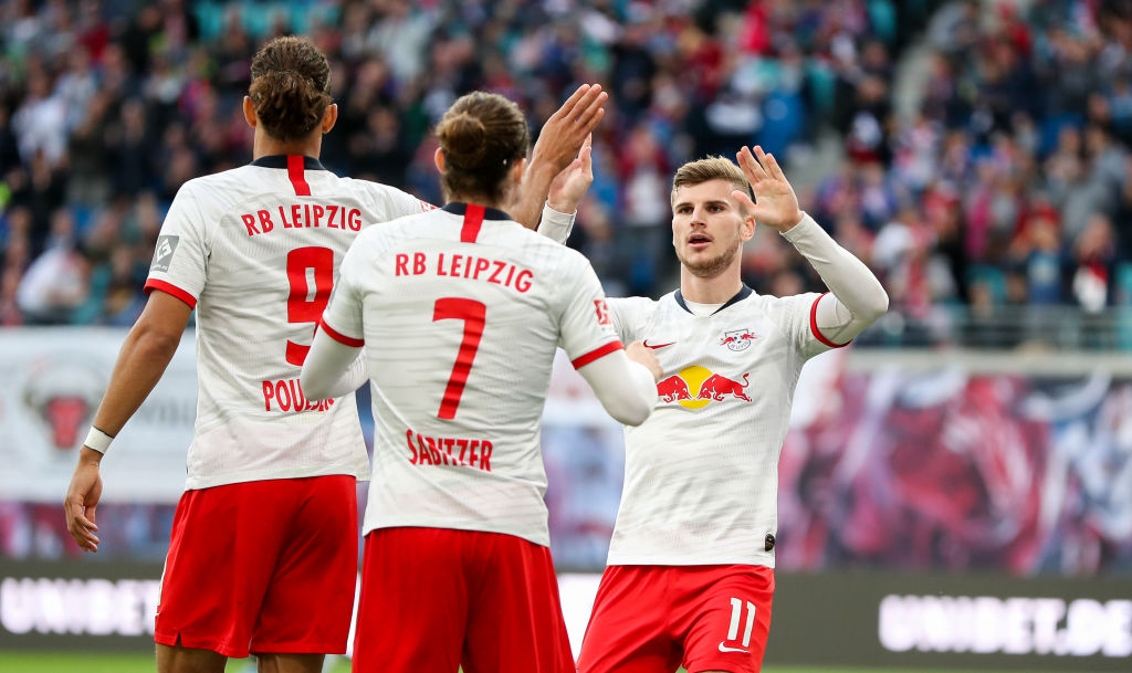 02 November 2019, Saxony, Leipzig: Soccer: Bundesliga, 10th matchday, RB Leipzig - FSV Mainz 05 in the Red Bull Arena Leipzig. The Leipzig players Yussuf Poulsen, Marcel Sabitzer and Timo Werner cheer for a goal. Photo: Jan Woitas/dpa-Zentralbild/dpa - IMPORTANT NOTE: In accordance with the requirements of the DFL Deutsche Fußball Liga or the DFB Deutscher Fußball-Bund, it is prohibited to use or have used photographs taken in the stadium and/or the match in the form of sequence images and/or video-like photo sequences. (Photo by Jan Woitas/picture alliance via Getty Images)