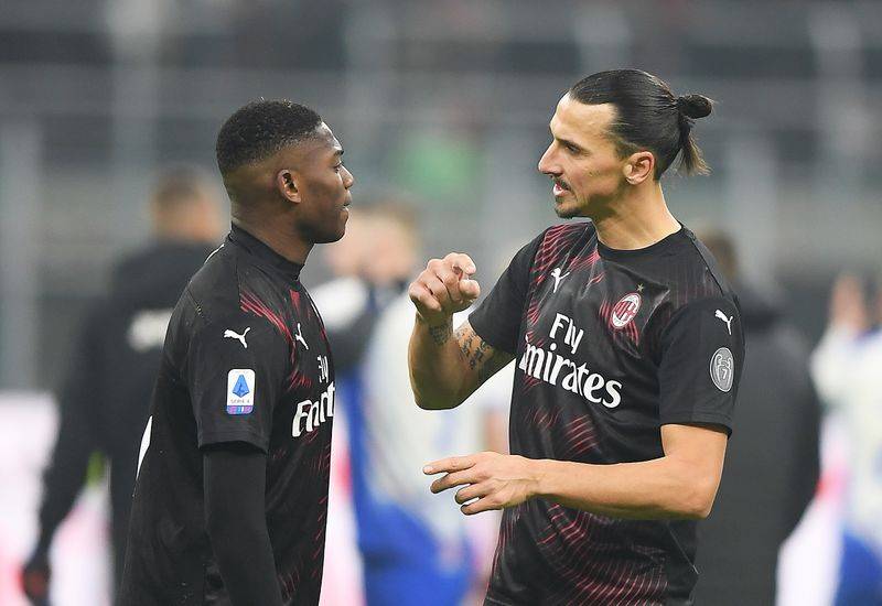 FILE PHOTO: Soccer Football - Serie A - AC Milan v Sampdoria - San Siro, Milan, Italy - January 6, 2020 AC Milan's Zlatan Ibrahimovic talks to Rafael Leao after the match REUTERS/Daniele Mascolo