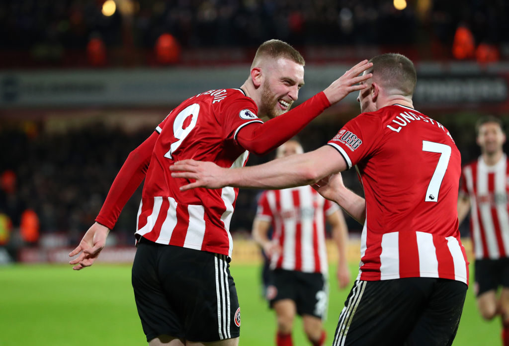 SHEFFIELD, ENGLAND - JANUARY 10: Oli McBurnie of Sheffield United celebrates with John Lundstram after scoring the opening goal during the Premier League match between Sheffield United and West Ham United at Bramall Lane on January 10, 2020 in Sheffield, United Kingdom. (Photo by Alex Livesey - Danehouse/Getty Images)