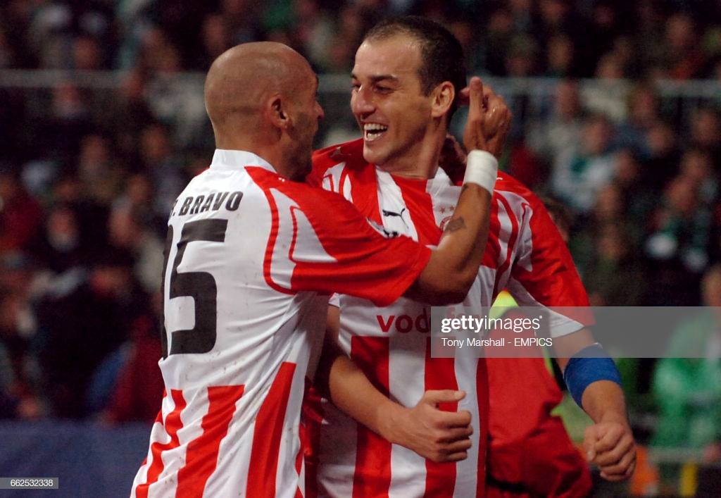 Olympiakos' Darko Kovacevic (right) celebrates his goal with team mate Raul Bravo. (Photo by Tony Marshall - PA Images via Getty Images)