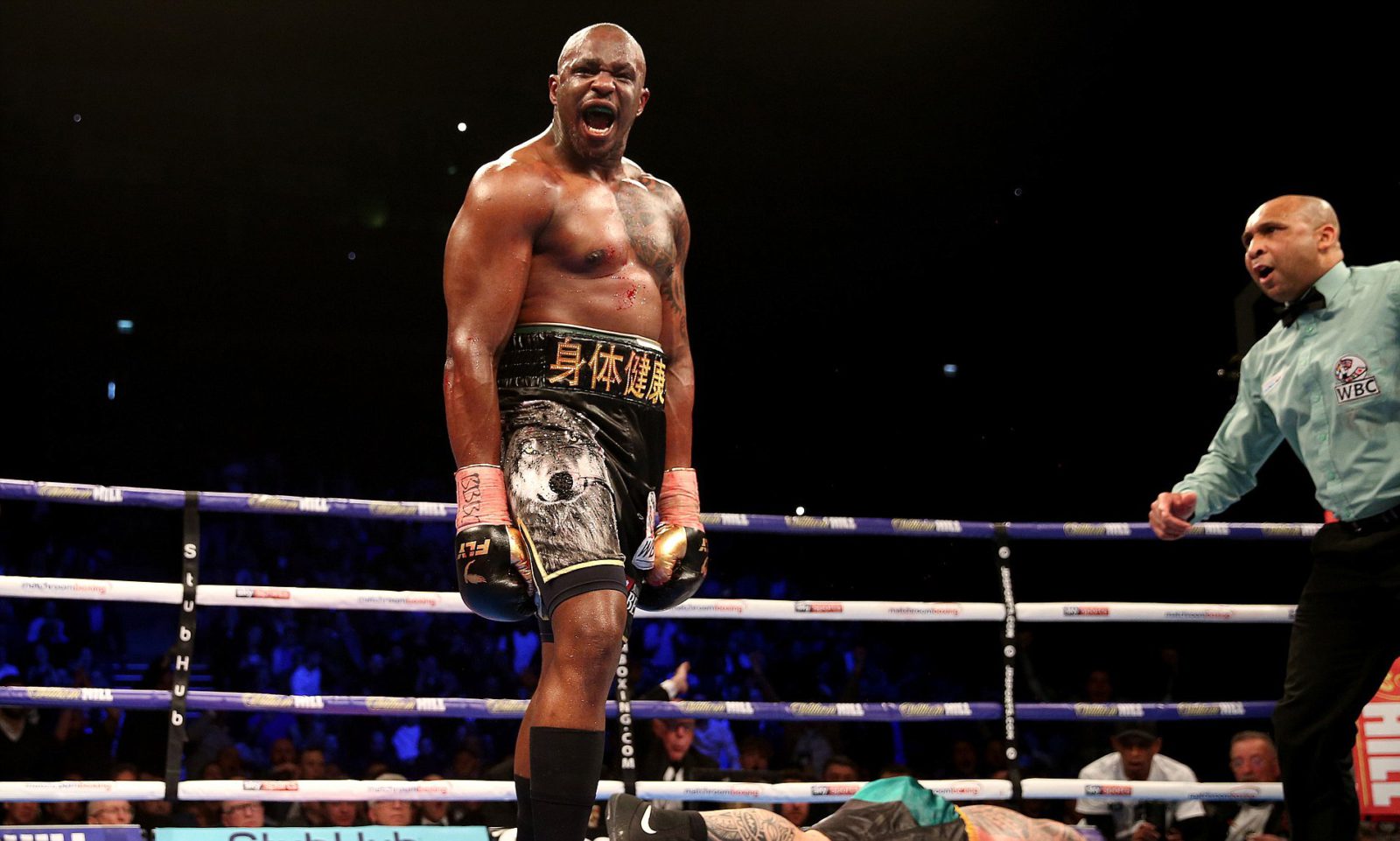 Dillian Whyte (left) celebrates after knocking out Lucas Browne (centre) in the WBC Silver Heavyweight Championship contest at the O2 Arena, London. PRESS ASSOCIATION Photo. Picture date: Saturday March 24, 2018. See PA story BOXING London. Photo credit should read: Steven Paston/PA Wire