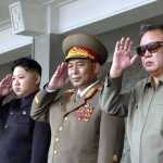 Kim-Jong-il-(front-L)-and-his-son-Kim-Jong-un-(R)-talk-as-they-visit-Mokran-Video-Company-in-Pyongyang3