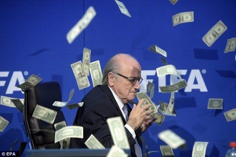 2AB2A77D00000578-0-FIFA_president_Sepp_Blatter_appeared_to_grasp_at_bank_notes_thro-a-4_1437498429188