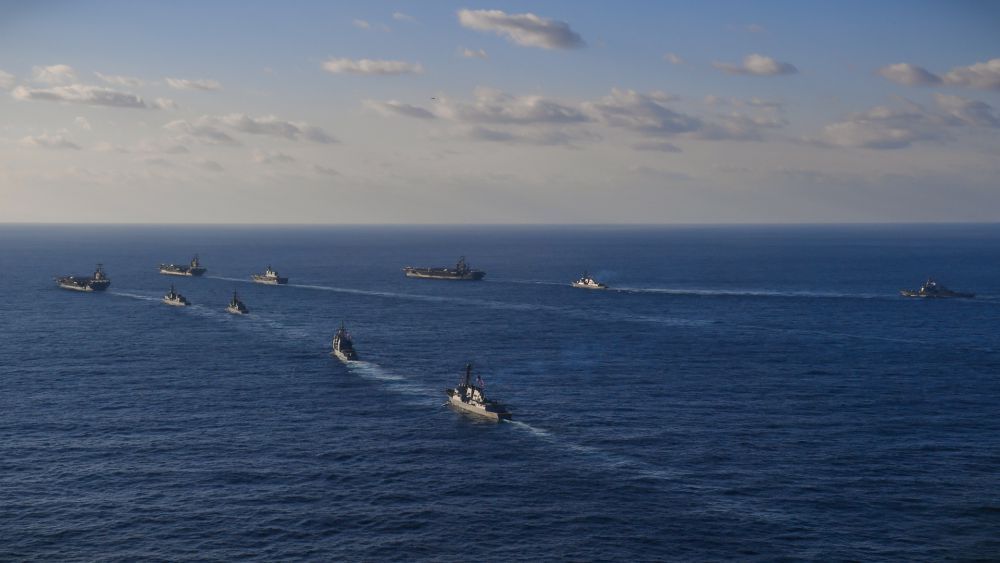 171112-N-XC372-2493 PACIFIC OCEAN (Nov. 12, 2017) The USS Ronald Reagan (CVN 76), USS Theodore Roosevelt (CVN 71) and USS Nimitz (CVN 68) Strike Groups transit the Western Pacific with ships from the Japan Maritime Self-Defense Force. The strike groups are underway and conducting operations in international waters as part of a three-carrier strike force exercise. The U.S. Navy has patrolled the Indo-Asia Pacific region routinely for more than 70 years promoting regional security, stability and prosperity. (U.S. Navy photo by Mass Communications Specialist 3rd Class Anthony Rivera/Released)