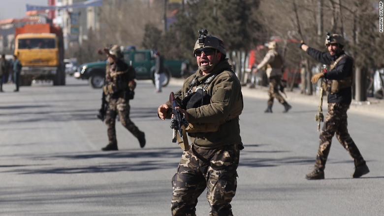 Security personnel arrive outside the site of a suicide attack in kabul, Afghanistan, Thursday, Dec. 28, 2017. Authorities say an attack took place on a Shiite cultural center in the Afghan capital killing and wounding dozens. (AP Photo/ Rahmat Gul)