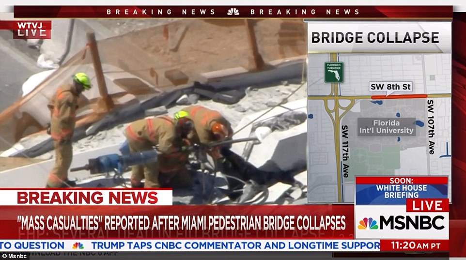 4A3A6DFD00000578-5506597-Rescue_workers_frantically_search_for_survivors_as_they_stand_at-a-76_1521141384664