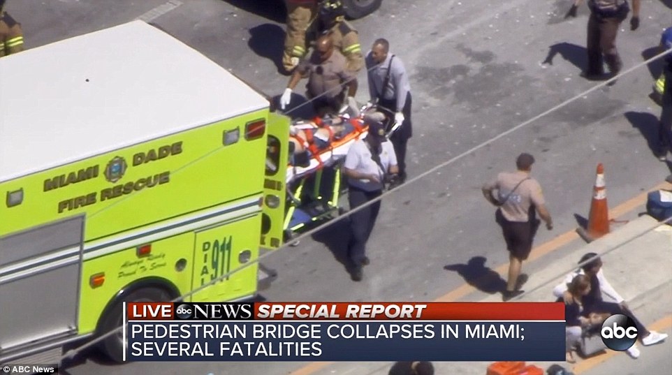 4A3A8E4200000578-5506597-Emergency_crews_load_a_victim_into_a_waiting_ambulance_at_the_sc-a-72_1521141384521