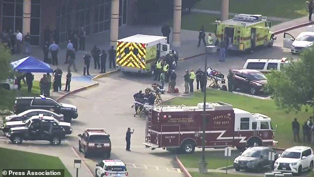 In this image taken from video emergency personnel and law enforcement officers respond to a high school near Houston after an active shooter was reported on campus, Friday, May 18, 2018, in Santa Fe, Texas. The Santa Fe school district issued an alert Friday morning saying Santa Fe High School has been placed on lockdown. (KTRK-TV ABC13 via AP)