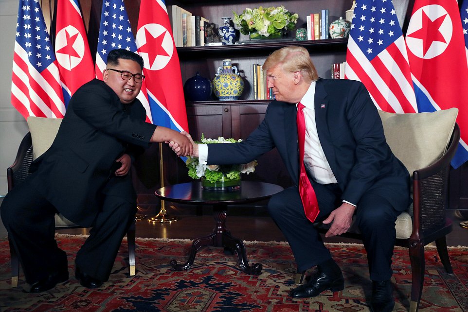U.S. President Donald Trump shakes hands with North Korea's leader Kim Jong Un at the Capella Hotel in Singapore