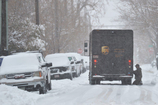 DENVER, CO - NOVEMBER 26: A UPS driver is checking the chains of tires at Bakers area in Denver on Tuesday. November 26, 2019. A major snowstorm is taking aim at the Denver metro area's biggest November snowstorms in recent memory. (Photo by Hyoung Chang/The Denver Post)