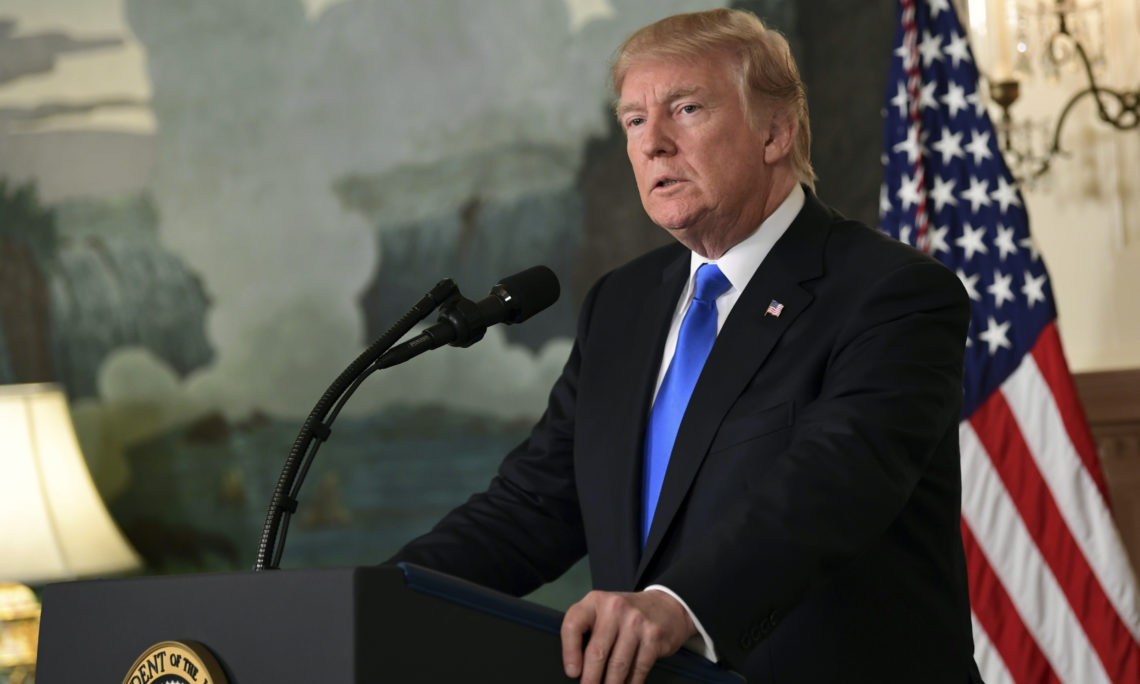 President Donald Trump speaks about Iran from the Diplomatic Reception Room at the White House in Washington, Friday, Oct. 13, 2017. Trump says Iran is not living up to the "spirit" of the nuclear deal that it signed in 2015, and announced a new strategy in the speech. He says the administration will impose additional sanctions on the regime to block its financing of terrorism. (AP Photo/Susan Walsh)