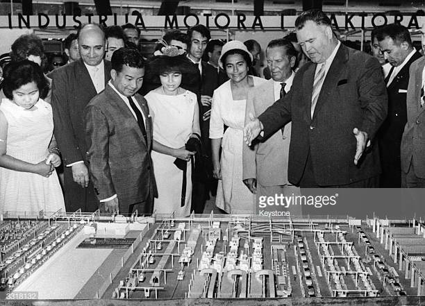 Princess Norodom Monineath Sihanouk, head of the Cambodian delegation at the Belgrade Conference of non-aligned countries, Mrs. Broz and President Josip Broz Tito (1892 - 1980) at the Yugoslav car factory stand at the 5th International Fair at Belgrade, August 30, 1961. (Photo by Keystone/Getty Images)