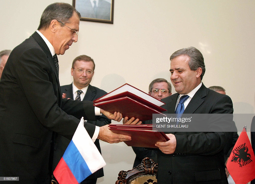 TIRANA, ALBANIA:  Albanian Foreign Minister Kastriot Islami (R) and his Russian counterpart, Sergei Lavrov, exchange documents after they signed bilateral agreements, in Tirana, 08 December 2004. Lavrov is on a one-day official visit to Albania.        AFP PHOTO / GENT SHKULLAKU  (Photo credit should read GENT SHKULLAKU/AFP via Getty Images)