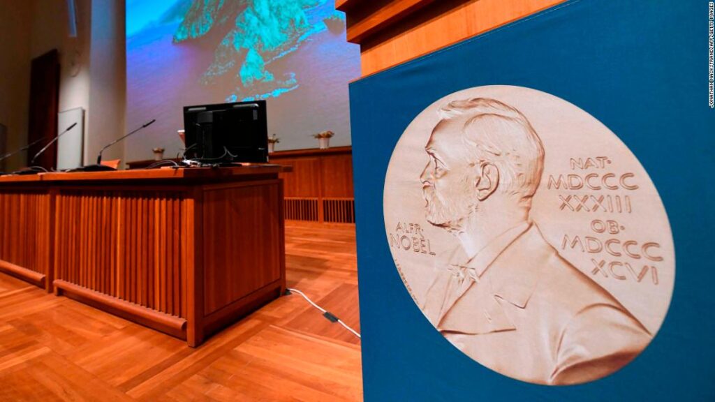 The portrait of Alfred Nobel is seen at the speaker's desk prior to the announcement of the winners of the 2020 Nobel Prize in Physiology or Medicine at the Karolinska Institute in Stockholm, Sweden, on October 5, 2020. (Photo by Jonathan NACKSTRAND / AFP) (Photo by JONATHAN NACKSTRAND/AFP via Getty Images)