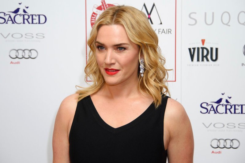 FILE - In this Jan. 17, 2016 file photo, Kate Winslet poses for photographers at the Critics Circle Awards at a central London venue, London. Winslet has joined the "Avatar" franchise which will reunite the actress with her "Titanic" director James Cameron. A spokesperson for 20th Century Fox confirmed the news Tuesday, Oct. 3, 2017. (Photo by Jonathan Short/Invision/AP, File)