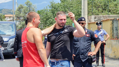 The desperation of little Elena's father, Giovanni Del Pozzo (C black T-shirt), the 5-year-old girl who disappeared and her body founded by her mother, in a field in Mascalucia, Catania, Italy, June 14, 2022. According to the mother, five-year-old Elena was kidnapped on 13 June by three men in the Sicilian town of Piano Tremestieri, near Catania. It was the woman who reportedly led authorities to the body after a night of questioning. ANSA/ORIETTA SCARDINO