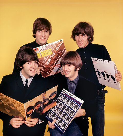 131111111233-beatles-holding-albums