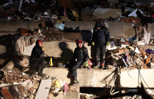 Rescuers search for victims and survivors amidst the rubble of collapsed buildings in Kahramanmaras, Turkey, after a 7.8-magnitude earthquake struck the country's southeast on February 7, 2023. - A major 7.8-magnitude earthquake struck Turkey and Syria, killing more than 3,000 people and flattening thousands of buildings as rescuers dug with bare hands for survivors. (Photo by Adem ALTAN / AFP) (Photo by ADEM ALTAN/AFP via Getty Images)