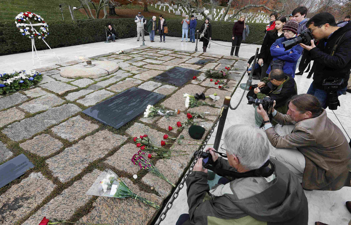 Visitors pay their respect at Arlington National Cemetery to mark the 50th anniversary of the assassination of former U.S. President John F. Kennedy in Arlington
