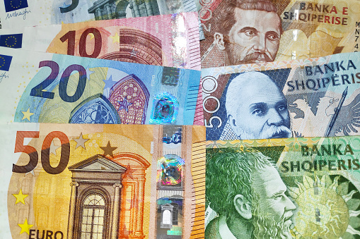 Close-up on a stack of Euros and Albanian Lek.