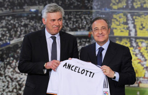 MADRID, SPAIN - JUNE 26:  Carlo Ancelotti (L) holds up a Real Madrid shirt as he stands alongside president Florentino Perez while being presented as the new head coach of Real Madrid at Estadio Bernabeu on June 26, 2013 in Madrid, Spain.  (Photo by Denis Doyle/Getty Images)