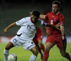 Luxembourg's Gilles Bettmer (R) fights f