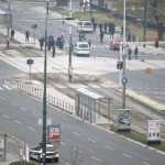 A gunman with an automatic weapon, lies on a street after being overwhelmed after he fired shots at the U.S. Embassy, in Sarajevo