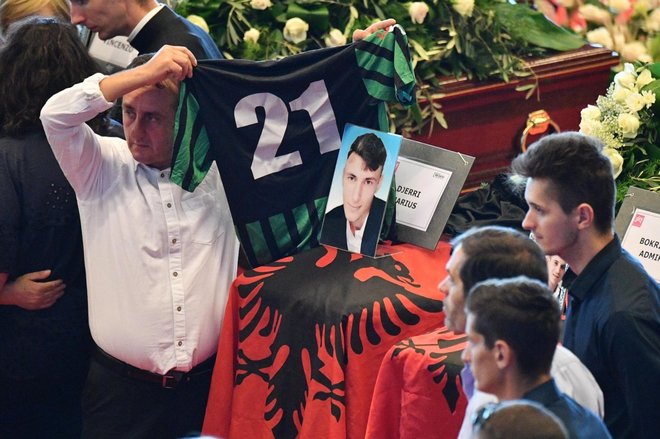 Players of the Campi Corniglianese soccer team mourn near the coffin of their teammate, 22 year-old Marius Djerri, one of the victims of the Genoa highway-bridge-collapse disaster, prior to the State funeral at the Fiera di Genova exhibition center, in Genoa, Italy, 18 August 2018. The Morandi bridge partially collapsed on 14 August, killing at least 41 people. ANSA/LUCA ZENNARO