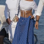17983006-7420237-Couple_The_singer_who_showcased_her_etched_abs_in_a_white_crop_t-m-66_1567447624892
