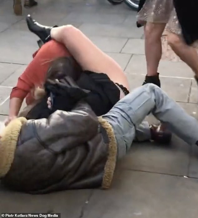 24254954-7961605-She_continues_to_pull_her_opponent_s_hair_and_wraps_hers_legs_ar-a-75_1580778947208
