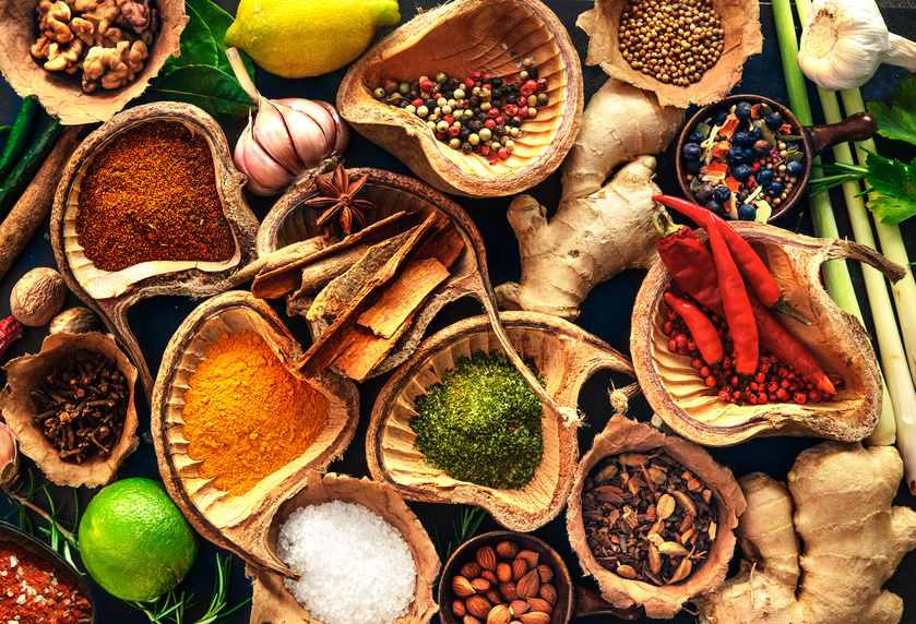Various herbs and spices on wooden table